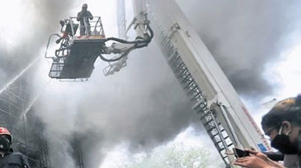 Delhi Fire Services personnel responding to emergency fire incident in the national capital