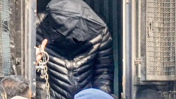 NIA officers escort Red Fort blast accused Jasir Wani after Delhi court extends custody.