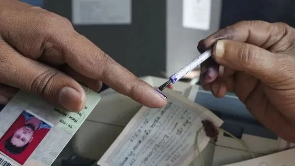 Voters queue at polling station in Maharashtra on January 15 public holiday